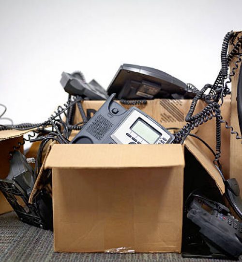Outdated office phones in boxes