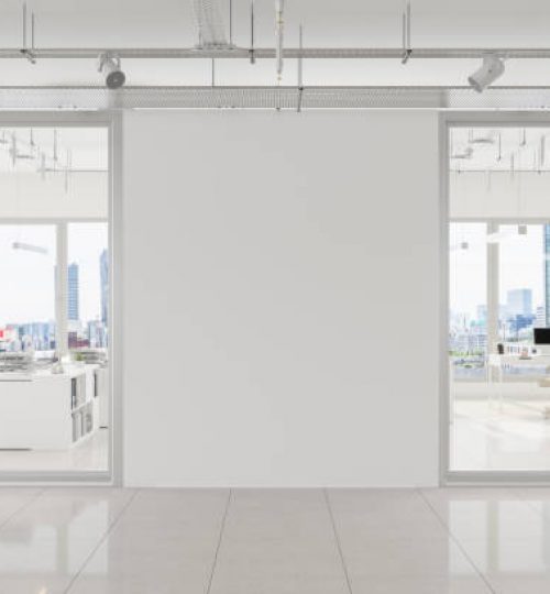 Modern Open Plan Office With White Blank Wall And Cityscape Background